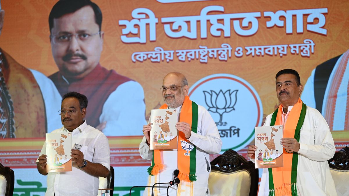 BJP state president Samik Bhattacharya, Union Home Minister Amit Shah, Leader of Opposition Suvendu Adhikari during the unveiling of 'BJP Sankalp Patra', the party's manifesto for the upcoming state Assembly elections, in Kolkata | Salil Bera