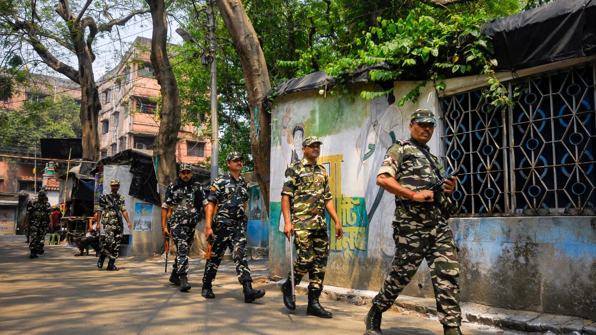 Security personnel take out a route march ahead of the West Bengal Assembly elections, in Howrah | PTI
