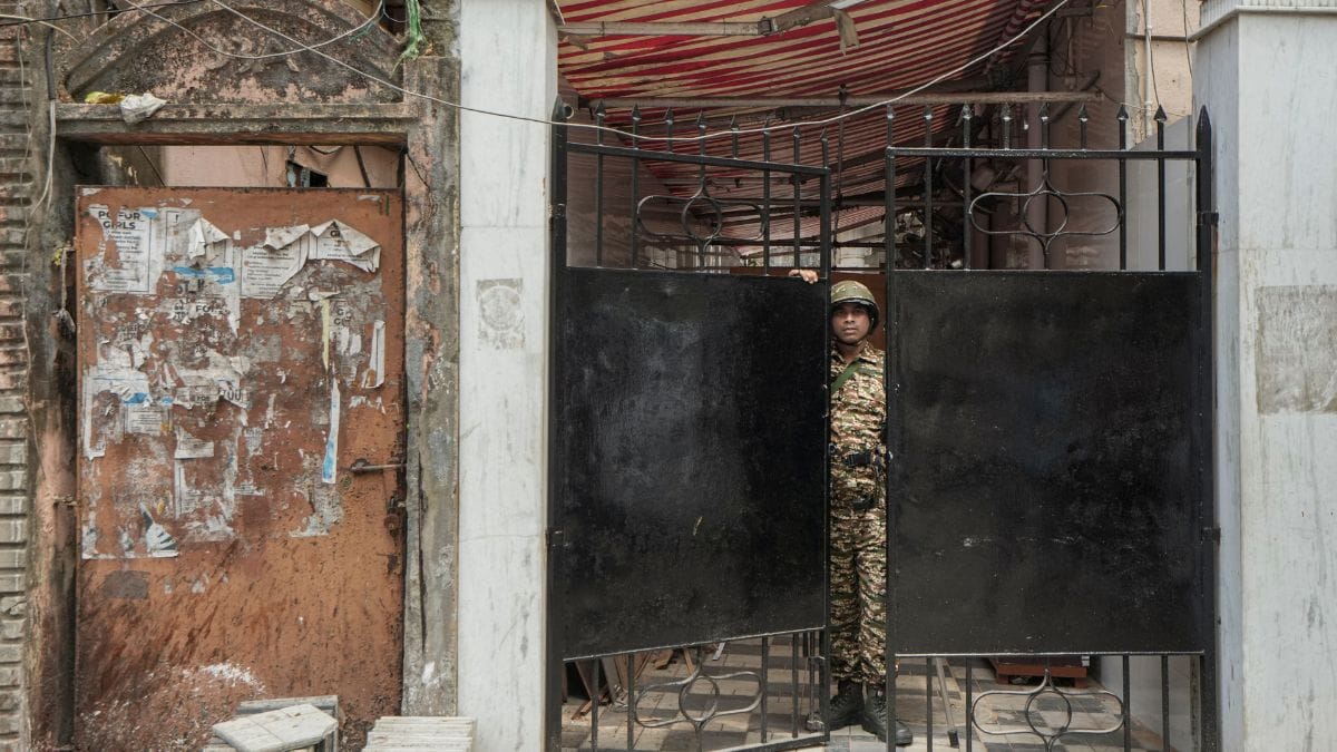 A security personnel stands guard outside the residence of TMC leader and Rashbehari Assembly constituency candidate Debasish Kumar during an Income Tax raid in Kolkata | PTI