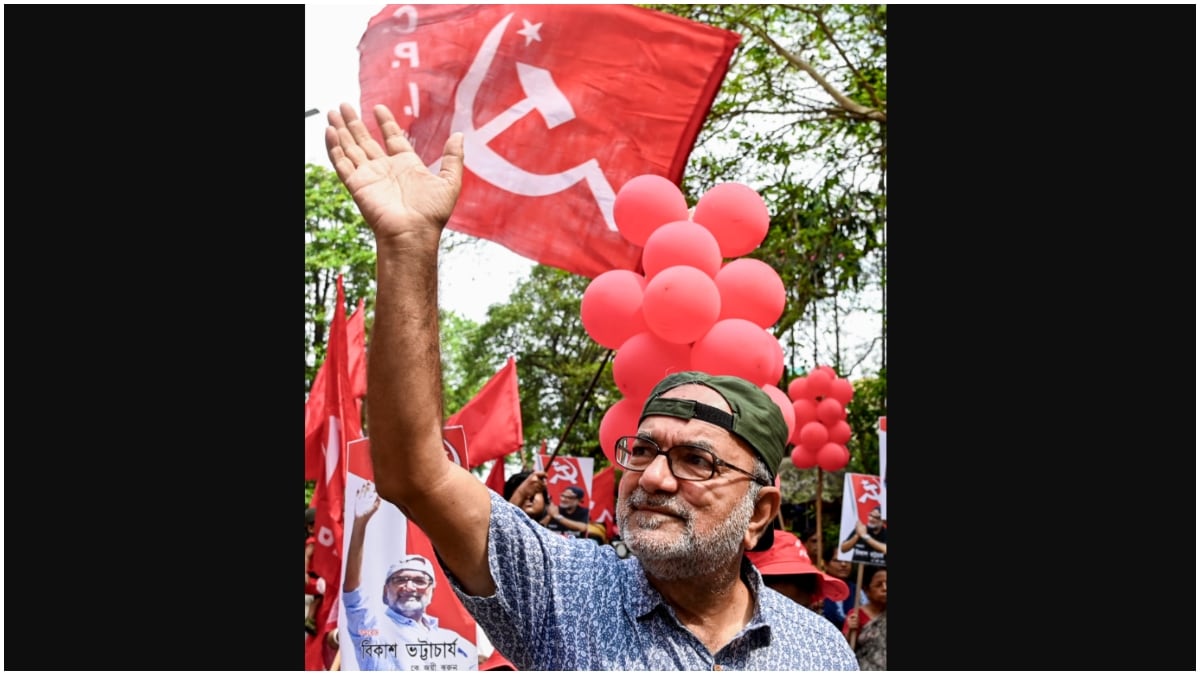 CPI(M) candidate Bikash Ranjan Bhattacharya from Jadavpur constituency waves during an election campaign | PTI