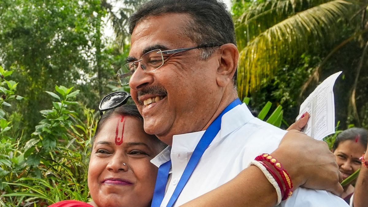 BJP candidate for Bhabanipur and Nandigram constituencies, Suvendu Adhikari, with a  supporter during voting in the first phase of the West Bengal Assembly elections in Purba Medinipur | PTI 