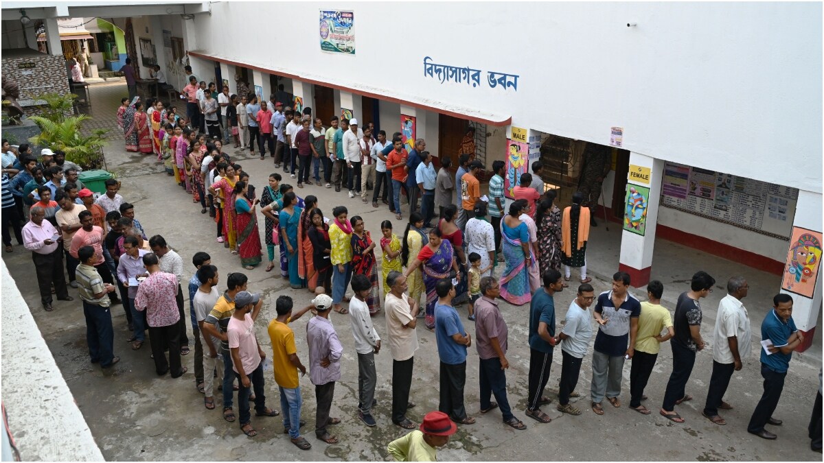 People stand in a queue to cast their votes at Haldia high school during the first phase of Assembly Election in West Bengal | Salil Bera