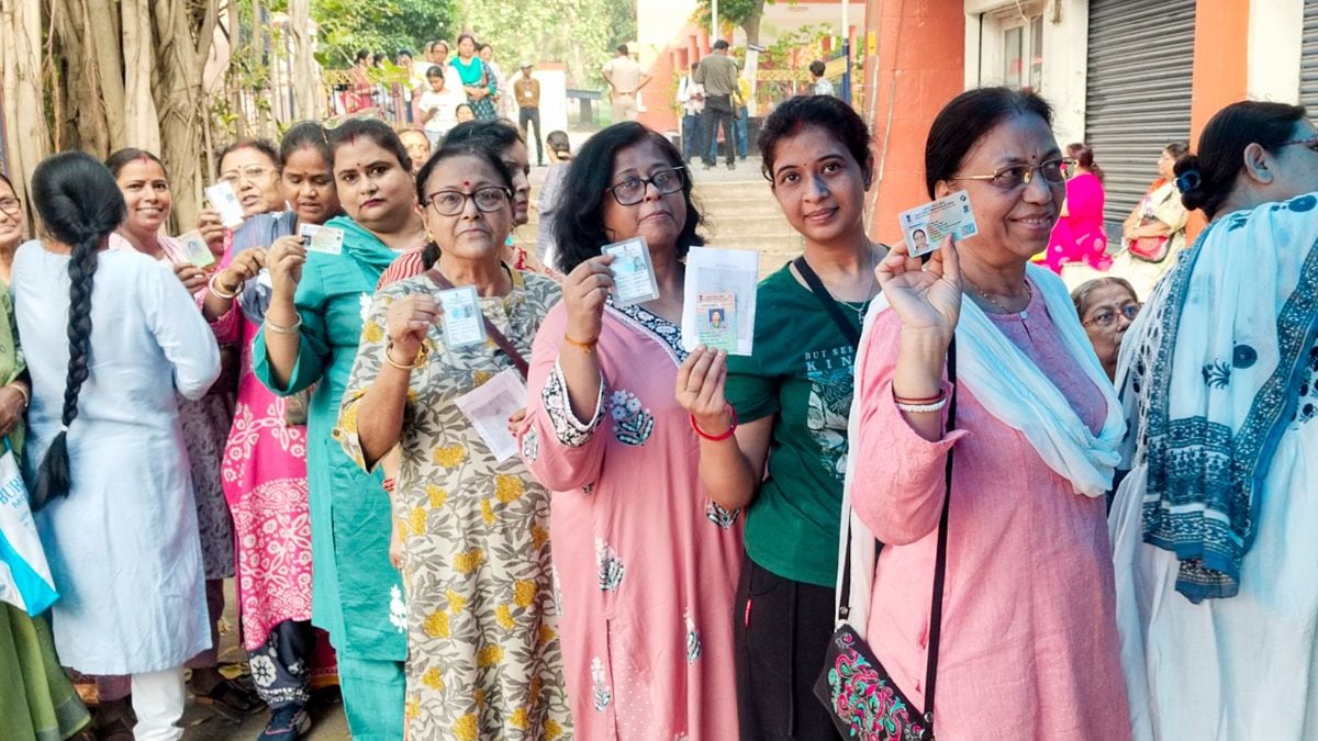 People wait in a queue to cast votes during the first phase of the West Bengal Assembly elections, in Asansol, Paschim Bardhaman district | PTI