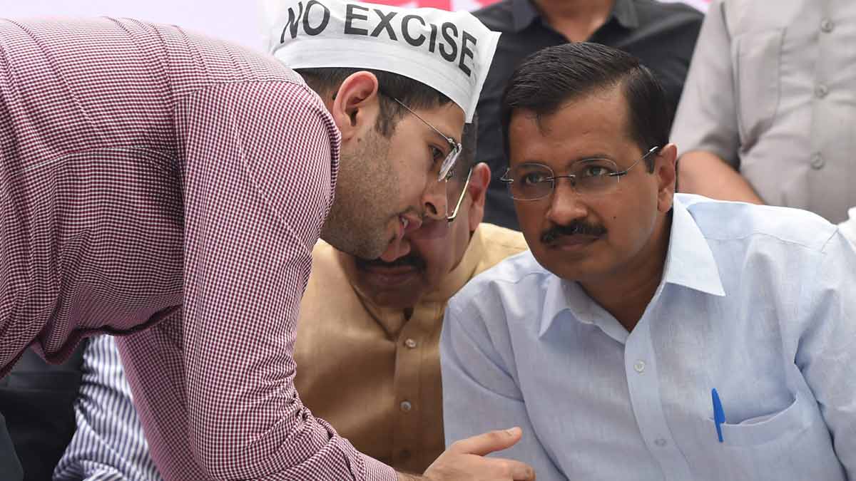 (File) Raghav Chadha (left) seen with Arvind Kejriwal at a protest at Jantar Mantar, in New Delhi | PTI