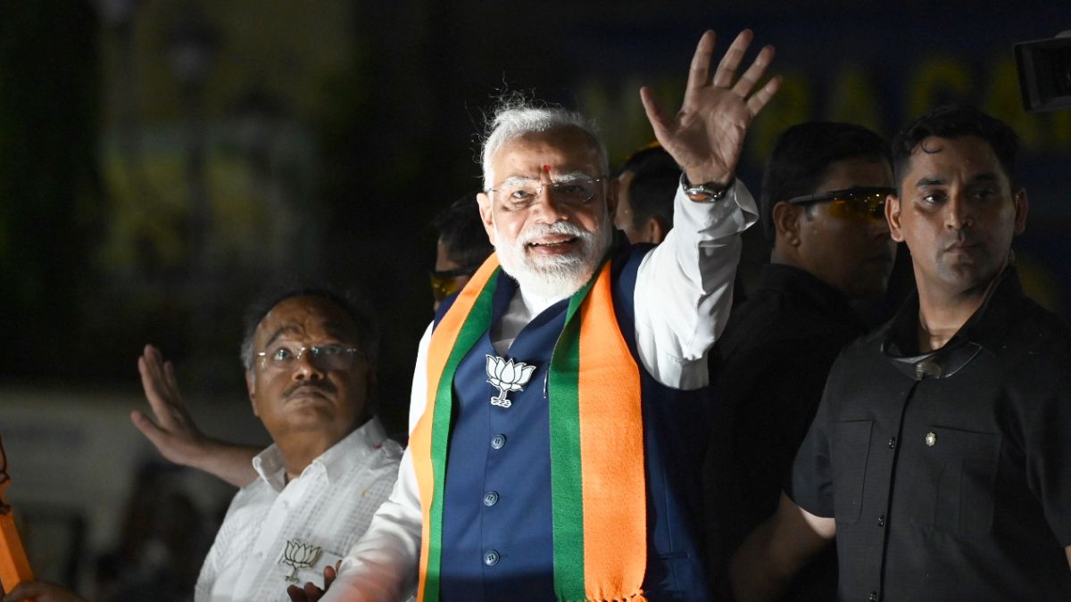 PM Modi waves to people at a road show in support of BJP candidates in North Kolkata's constituencies today | Salil Bera