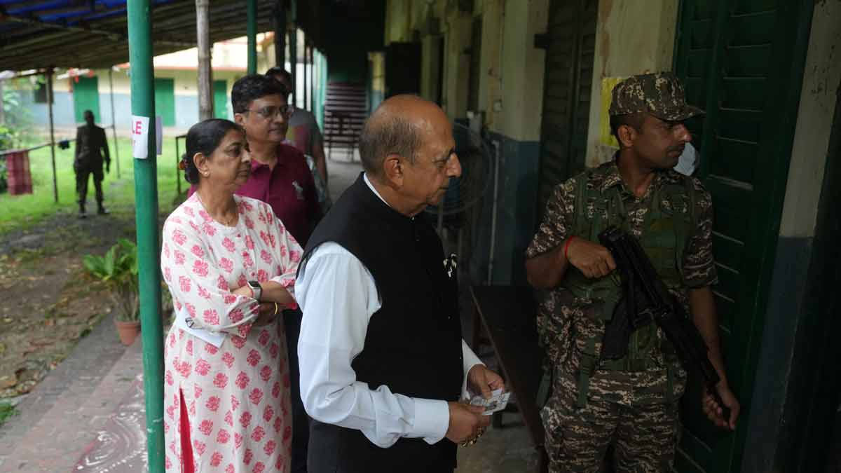 Newly-appointed High Commissioner of India to Bangladesh, Dinesh Trivedi waits in a queue at a polling station in Kolkata | PTI