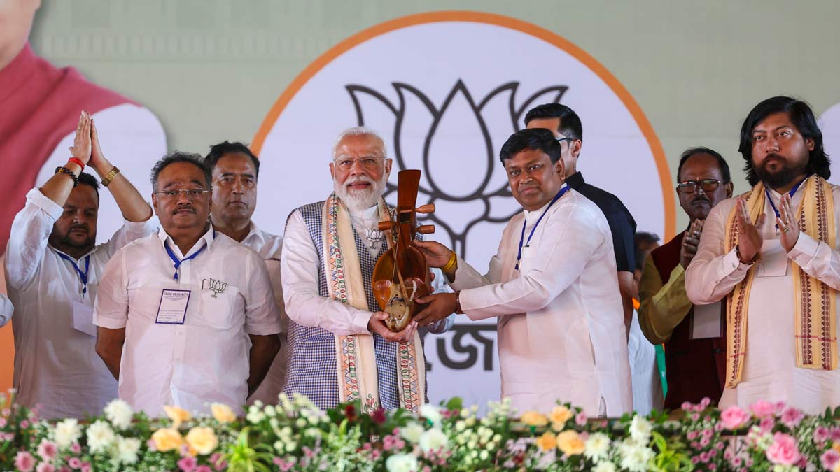 Prime Minister Narendra Modi being felicitated by Union Minister of State and BJP leader Sukanta Majumdar during a public meeting ahead of the West Bengal Assembly elections, in Cooch Behar, West Bengal | PTI