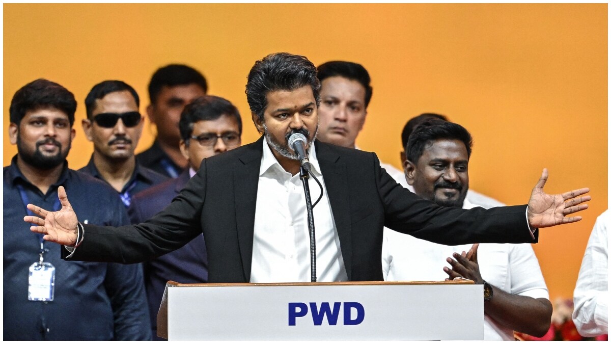 Newly elected chief minister of India's Tamil Nadu state, C. Joseph Vijay (C) takes oath during his swearing-in ceremony in Chennai | AFP