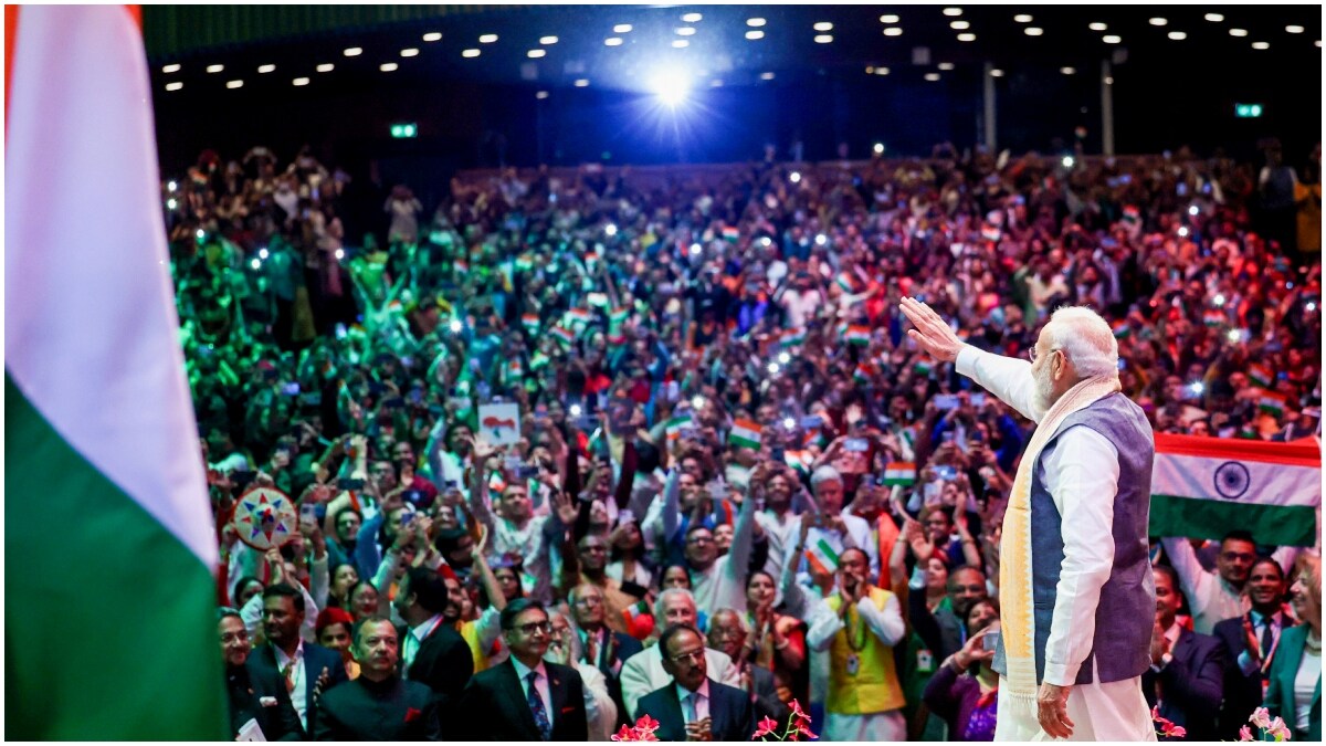 Prime Minister Narendra Modi waves to a gathering during a community programme, in The Hague, Netherlands | PTI