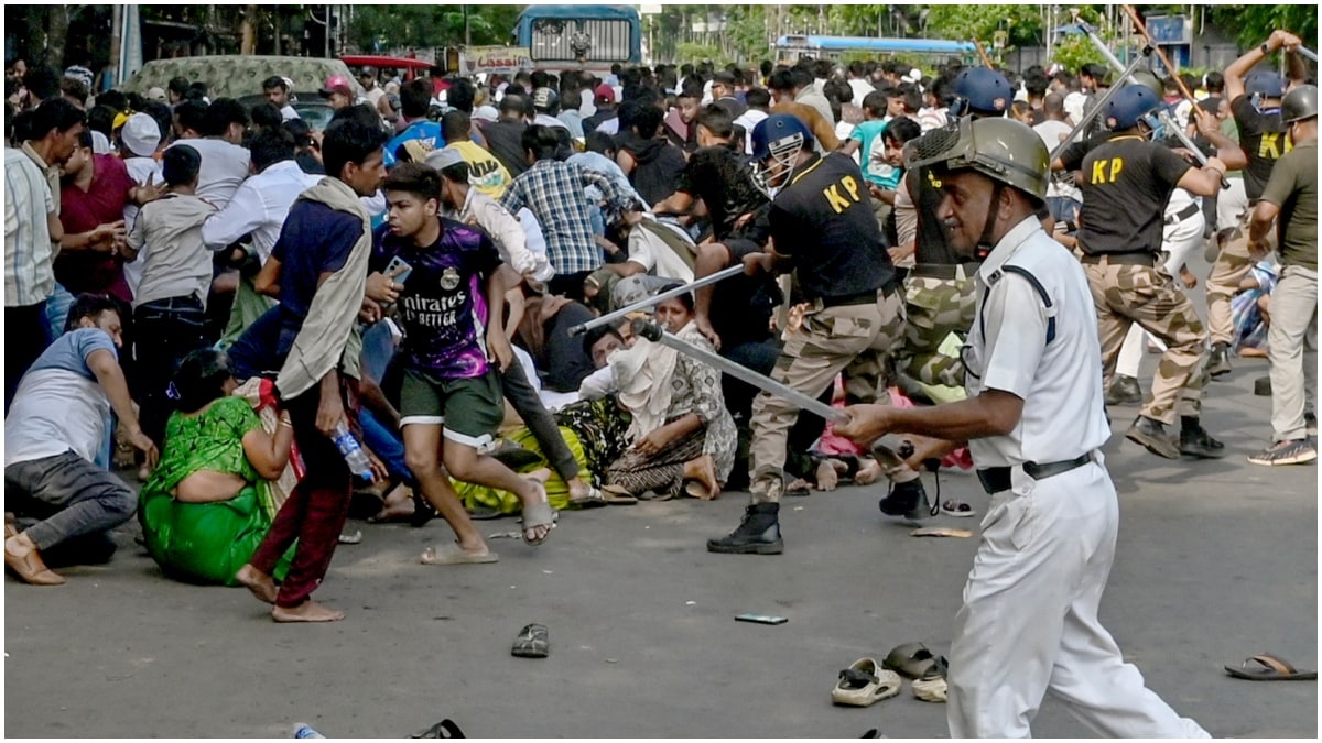 Police lathicharge protestors during protest against a recent demolition drive at Tiljala area among other issues, at Park Circus area, in Kolkata | PTI