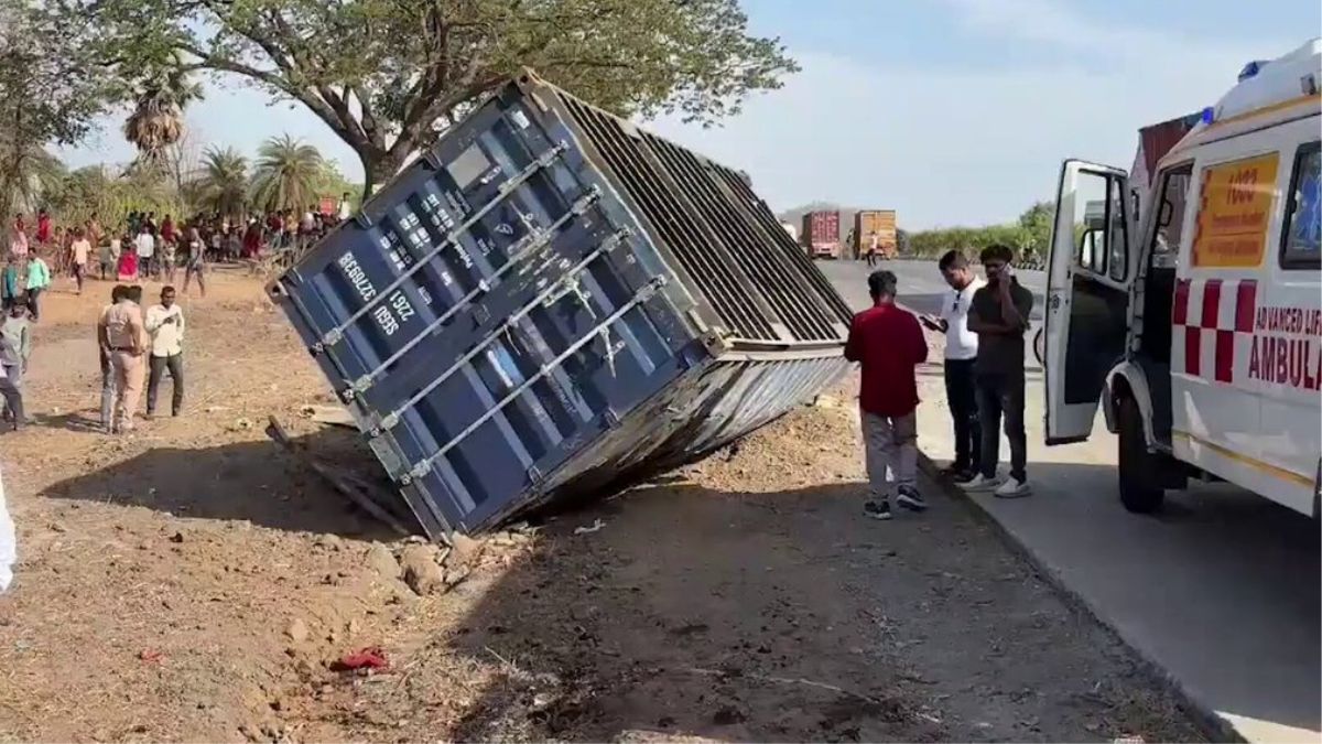 A overturned portion of a container truck after it collided with a tempo traveller on May 18, 2026 on the Mumbai-Ahmedabad Highway | X/@ians_india