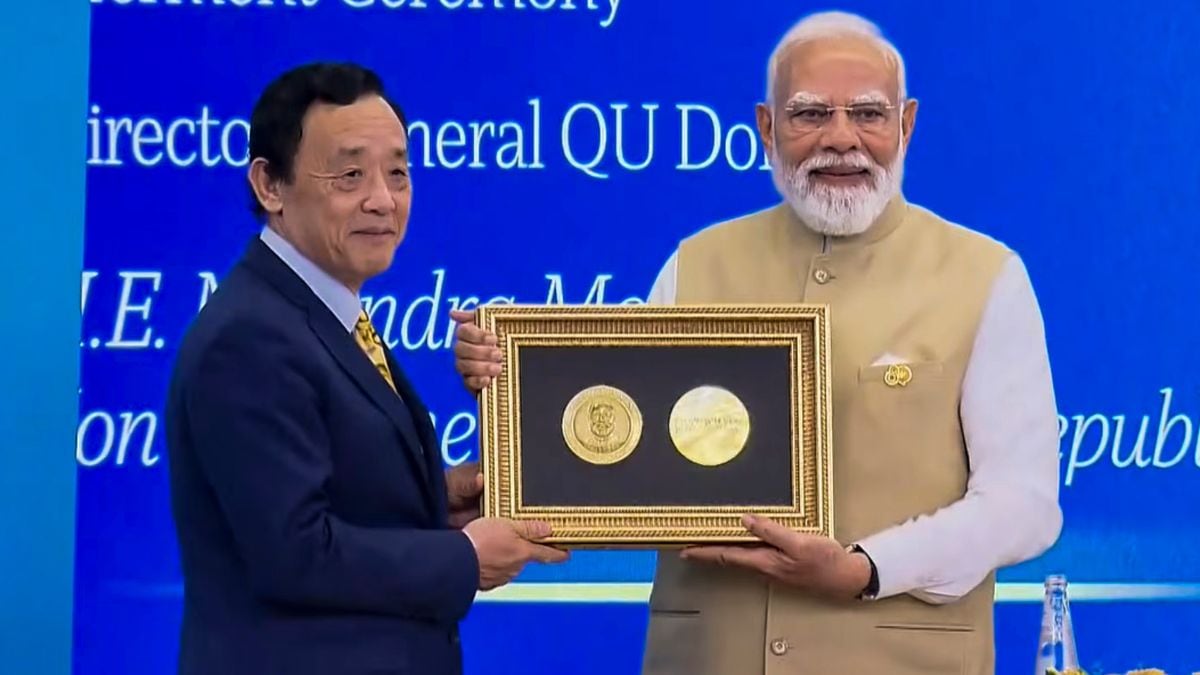 FAO director general Qu Dongyu (L) confers the Agricola Award on PM Narendra Modi (R) | PTI
