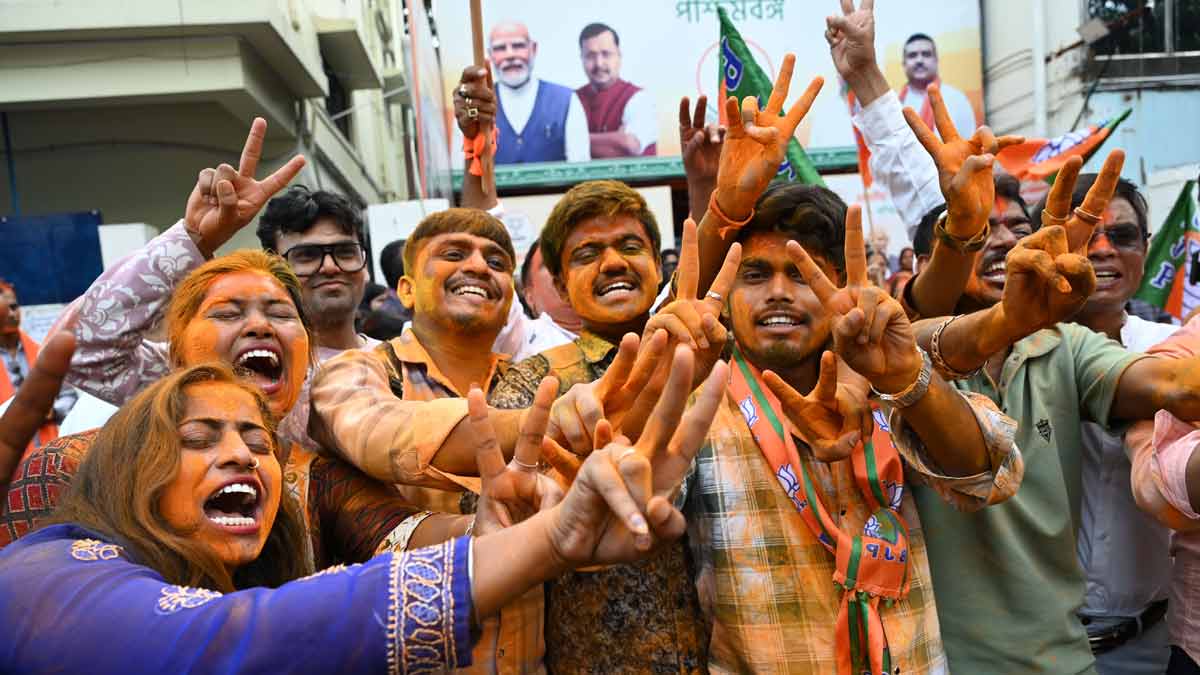 BJP workers celebrate the party's win in the West Bengal Assembly elections, in Kolkata | Salil Bera