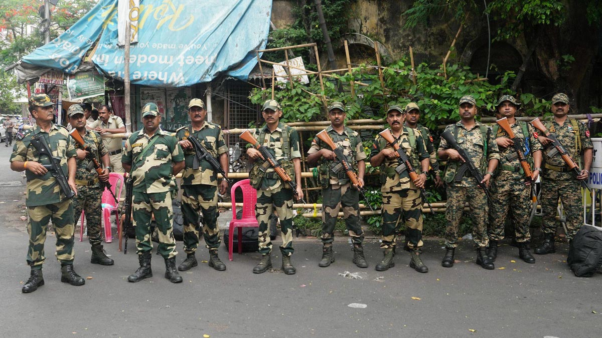 Security personnel stand guard outside a vote counting centre in Kolkata | PTI
