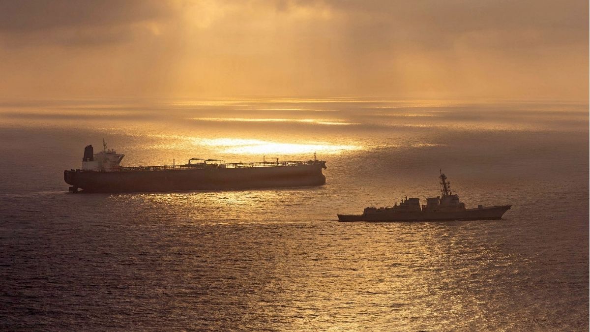 Arleigh Burke-class guided-missile destroyer USS Rafael Peralta (DDG 115) implementing a maritime blockade against the Iran-flagged crude oil tanker vessel Herby on April 24, 2026. | AFP /US Navy