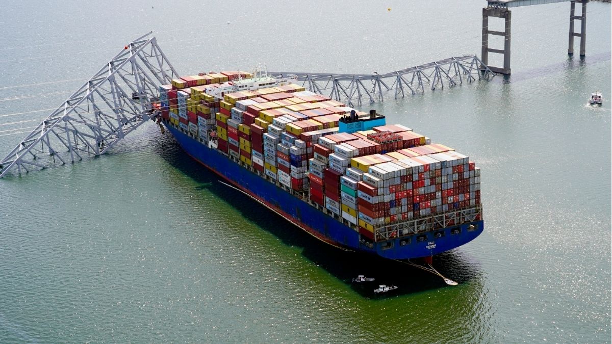 FILE: MV Dali stuck under part of the structure of the Francis Scott Key Bridge after the cargo ship hit the bridge, March 26, 2024, in Baltimore. | Maryland National Guard/AP