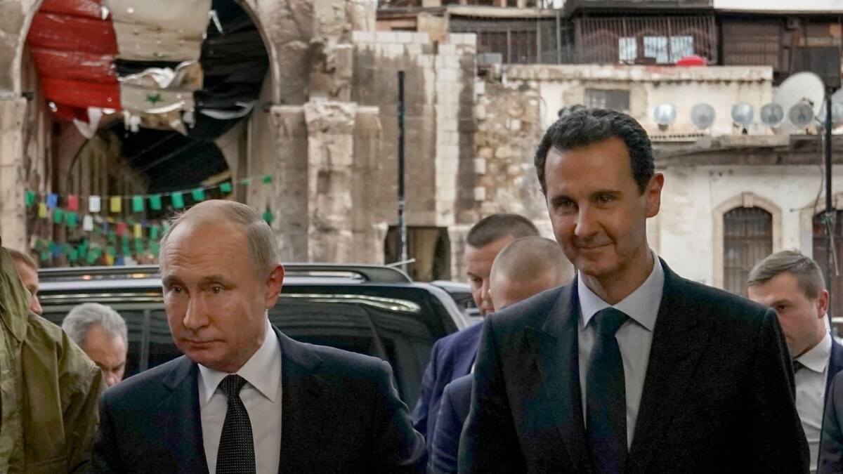 Syrian President Bashar al-Assad (R) with Russian President Vladimir Putin | AFP