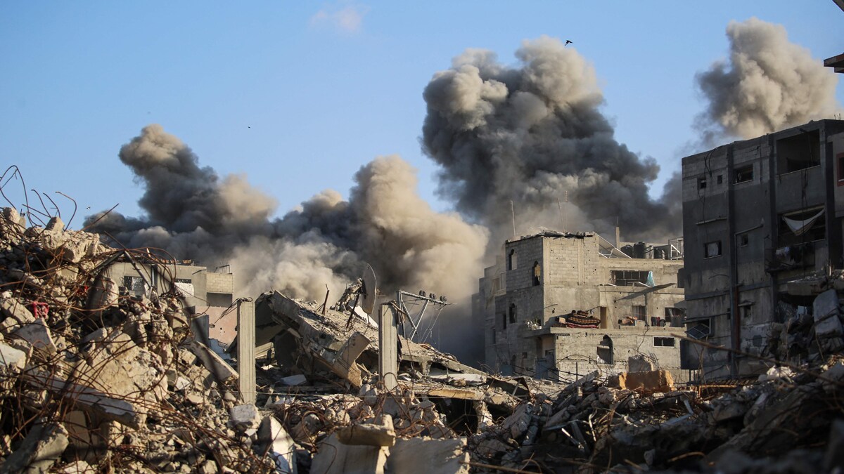 Smoke billows following an Israeli strike that targeted a building in the Bureij camp for Palestinian refugees in the central Gaza Strip on October 19, 2025. Gaza's civil defence agency said a series of Israeli air strikes on October 19 killed at least 11 people across the territory, as Israel and Hamas traded blame for violating a ceasefire. (Photo by Eyad BABA / AFP)