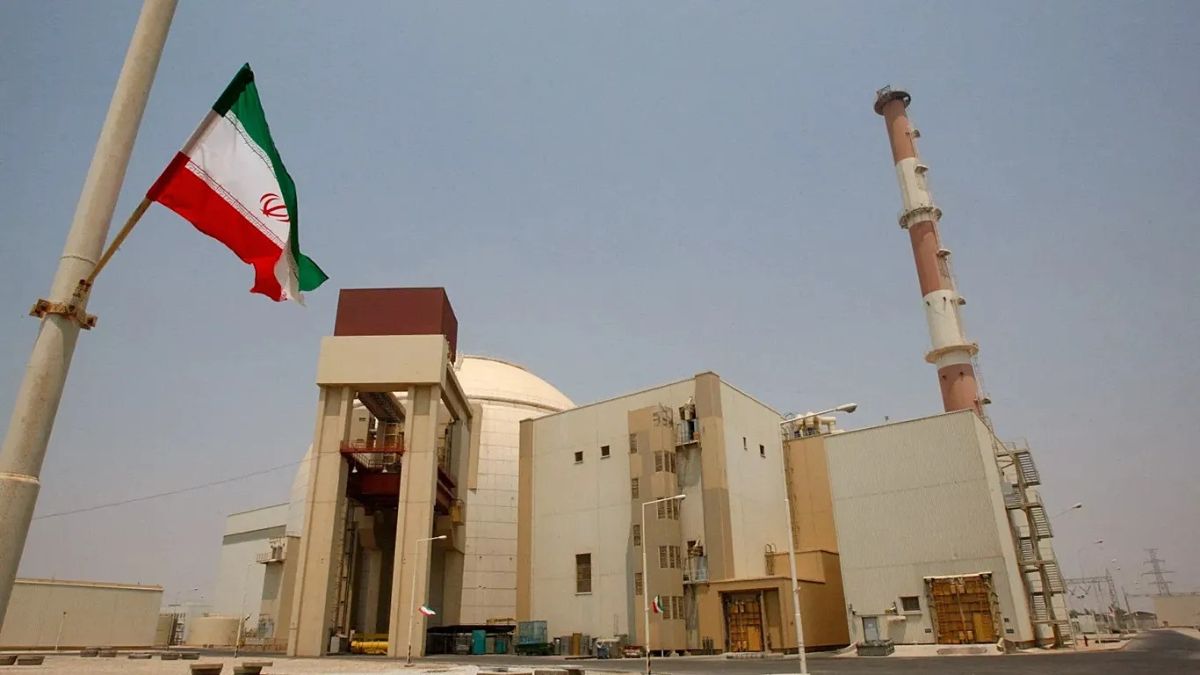(Representative image) An Iranian flag in front of the reactor building of the Bushehr nuclear power plant in 2010 | AP