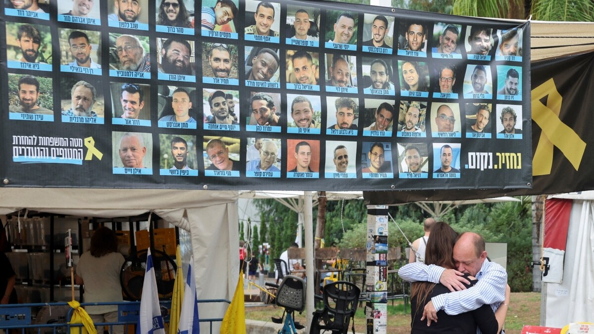 A banner with photos of hostages at the "Hostages square" | Reuters