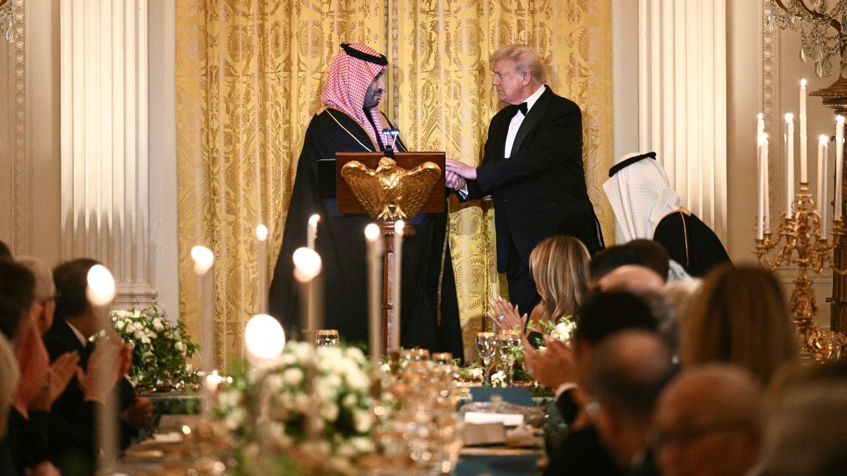 US President Donald Trump (R) shakes hands with Crown Prince of Saudi Arabia Mohammed bin Salman during an official dinner in the East Room of the White House in Washington, DC | AFP