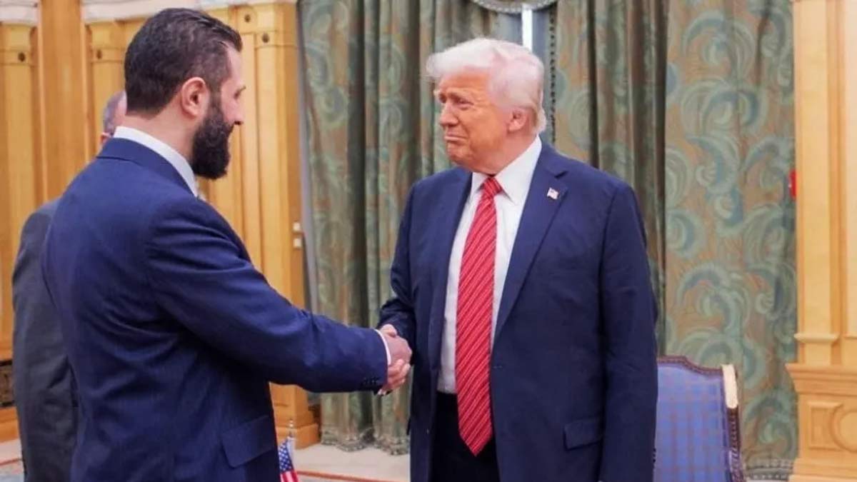 [File] Donald Trump and Ahmed al-Sharaa during their meeting in Riyadh | Reuters
