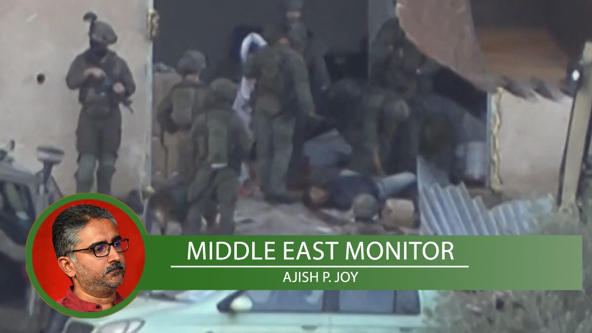 This video grab taken from AFPTV footage filmed on November 27, 2025, shows Israeli soldiers surrounding the body of one of two Palestinian men who were shot dead after seemingly surrendering to Israeli forces during a military operation in the Israeli-occupied West Bank city of Jenin | AFP