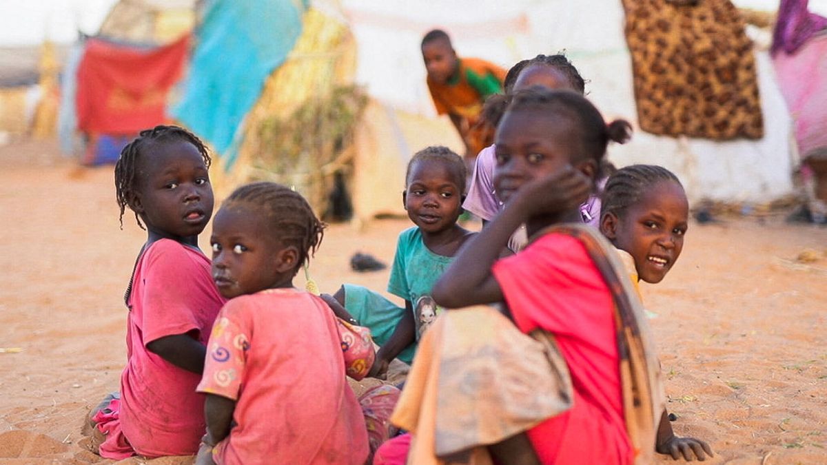 Displaced Sudanese children who fled with their families during violence in al-Fashir, sit inside a camp shelter | Reuters 