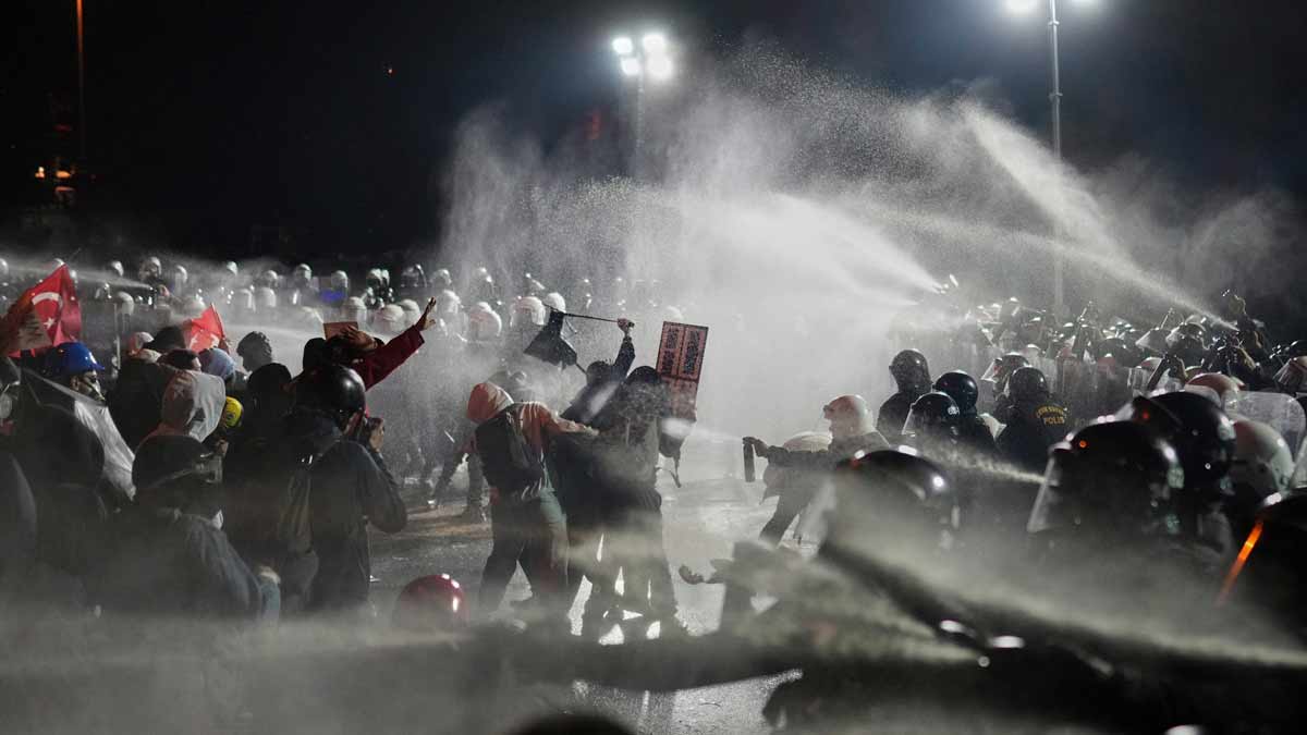 Riot police officers clash with protesters during a protest after Istanbul's Mayor Ekrem Imamoglu was arrested and sent to prison, in Istanbul, Turkey | AP