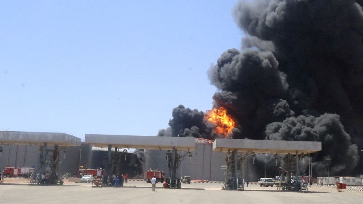 A general view shows large plume of smoke and fire rising from fuel depot after what military sources told Reuters is a Rapid Support Forces (RSF) drone attack in Port Sudan targetting fuel storage facilities in Port Sudan | Reuters 