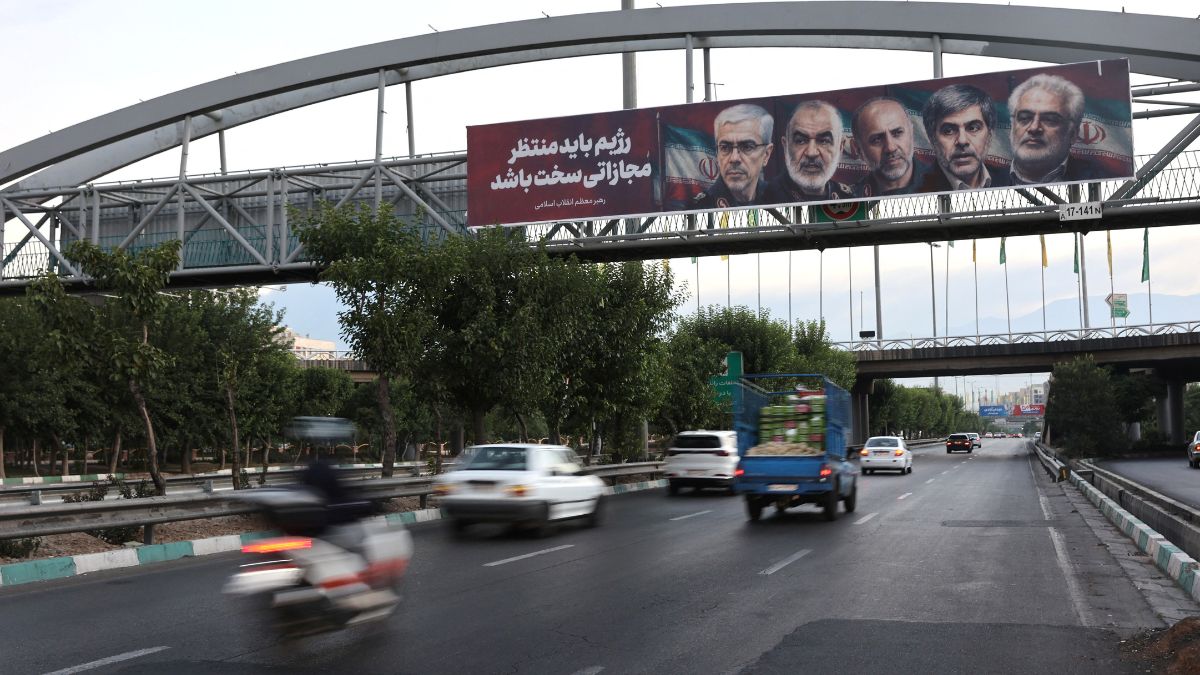Pictures of those killed in Israeli strikes on Iran are displayed on a street, in Tehran | Reuters 