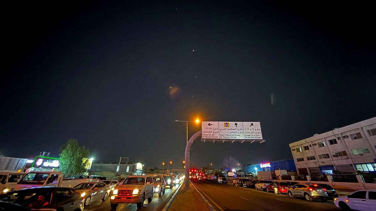 Traces are seen in the sky after Iran's armed forces say they targeted The Al-Udeid base in a missile attack, as seen from Doha | Reuters