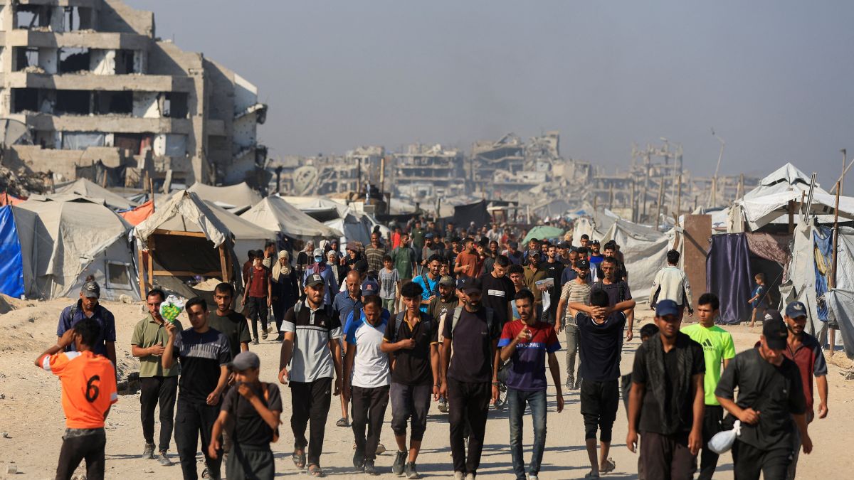 Palestinians gather as they wait for aid supplies to enter Gaza, in the northern Gaza Strip | Reuters 