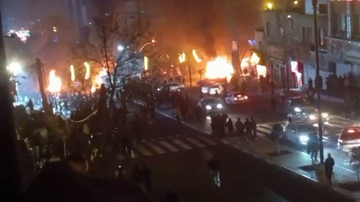Cars set on fire during a protest on Saadat Abad Square in Tehran | UGC/AFP