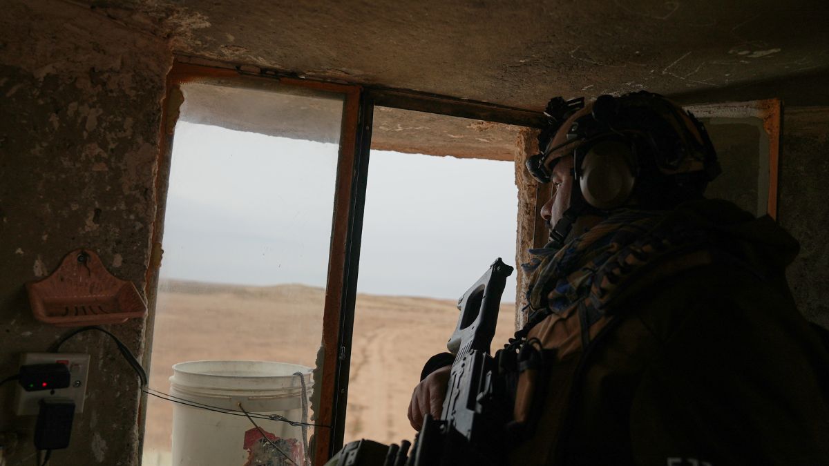 An Iraqi Border Guard sits at an outpost along the Syrian border amid heightened security following recent fighting in Syria, in Sinjar, northern Iraq | AP