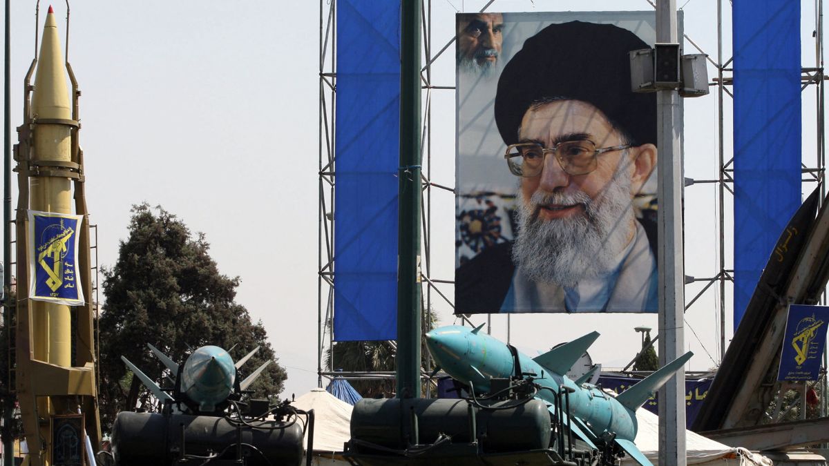Large portrait of Iran's supreme leader Ayatollah Ali Khamenei amid Iran's surface-to-surface Shahab-2 (L) and two Sayyad-1 surface-to-air missiles (C) and Zelzal (R) missile | AP