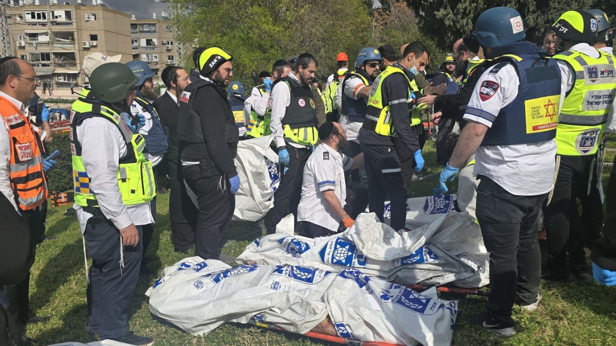 Rescue personnel take part in relief operations in Israel's Beit Shemesh, which was hit by an Iranian missile on Sunday