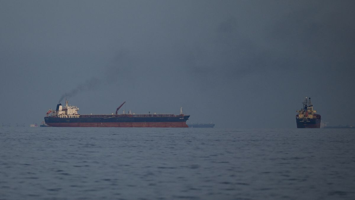 Oil tankers and cargo ships line up in the Strait of Hormuz as seen from Khor Fakkan, United Arab Emirates | AP