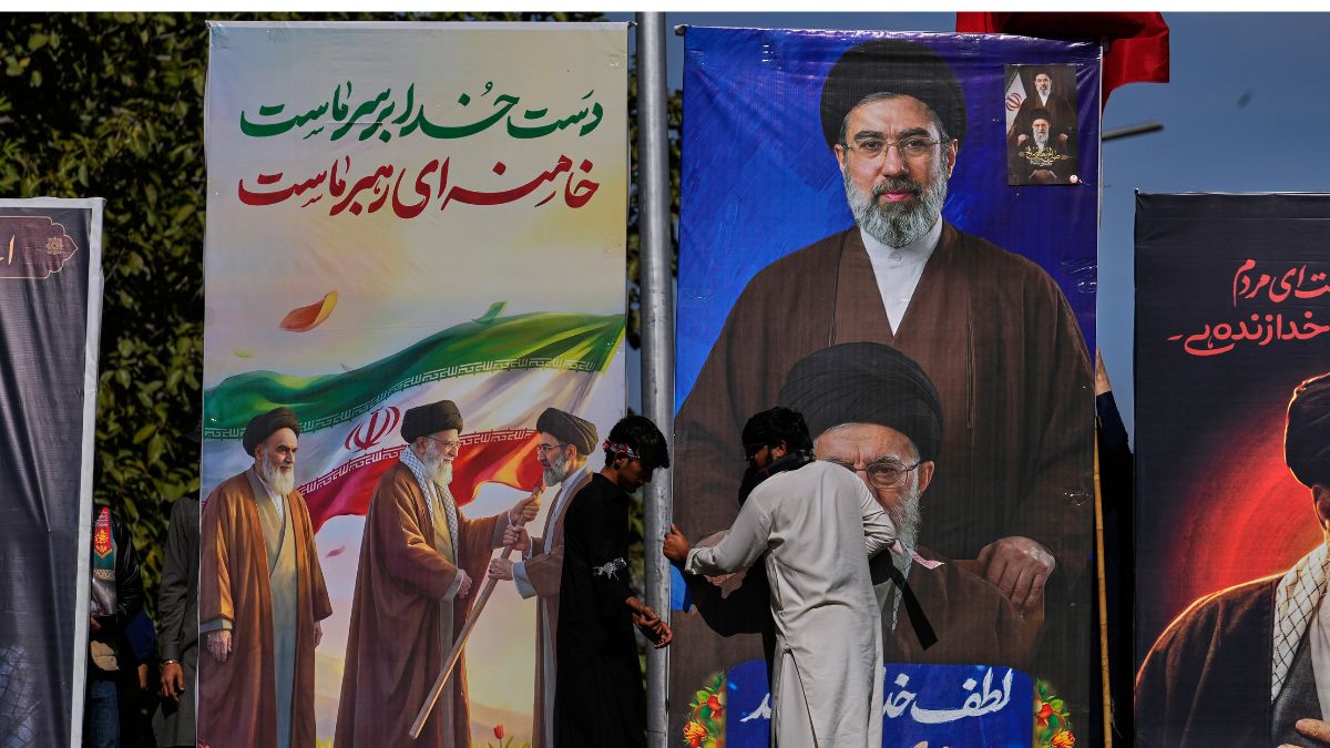 Huge billboards of Iranian supreme leaders Ayatollah Mojtaba Khamenei and his late father Ayatollah Ali Khamenei being placed during the annual Al-Quds Day rally | AP