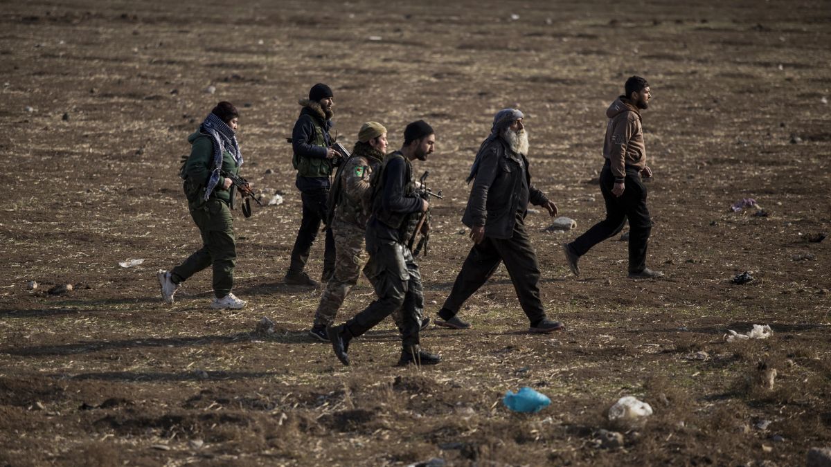 [File] Kurdish-led fighters backed by the US escort suspected Islamic State militants in Hassakeh, Syria, on January 26, 2022 | AP