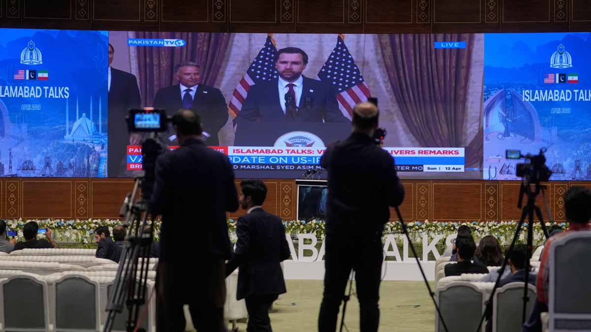 Cameramen film the U.S. Vice President JD Vance press speech telecasting by state run television after his meeting with Iranian officials at a media centre, in Islamabad | AP