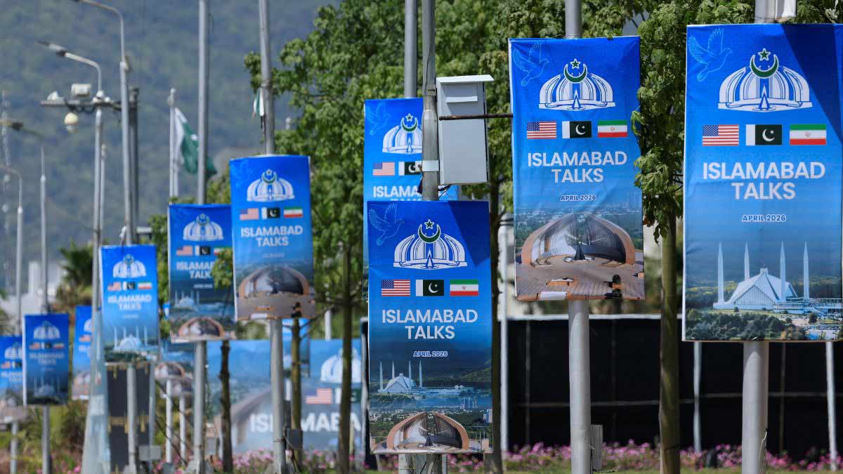 Hoardings are mounted on lamp posts, as Pakistan prepares to host the United States and Iran for a possible second phase of peace talks in Islamabad | Reuters