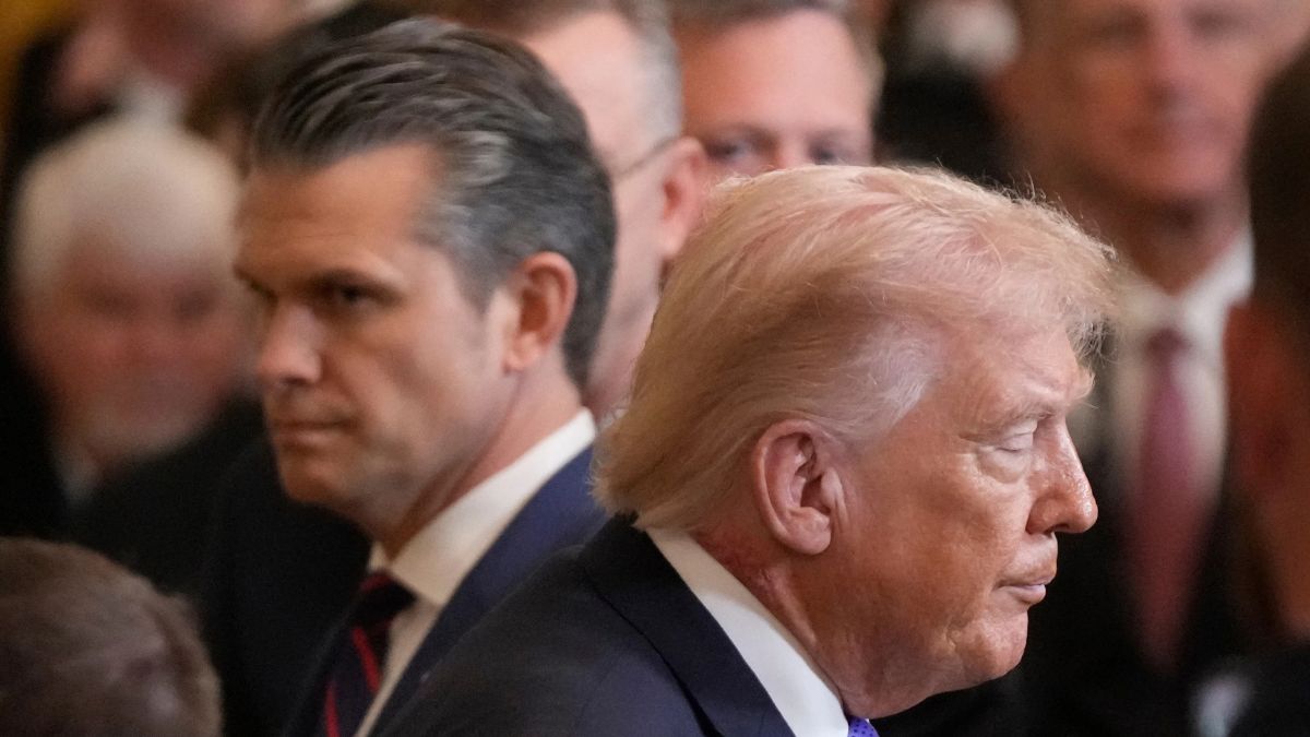 US President Donald Trump (foreground) and defence secretary Pete Hegseth (background) | AP