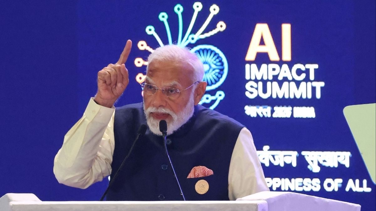Prime Minister Narendra Modi delivers a speech at the AI Impact Summit in New Delhi on February 19, 2026. | AFP