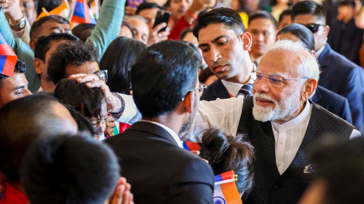 Prime Minister Narendra Modi being welcomed by the Indian community, in Vientiane, Laos | PTI