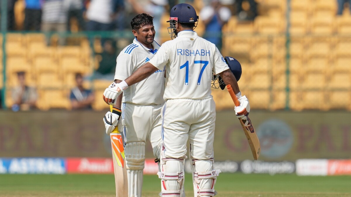 India's Sarfaraz Khan, left, celebrates with batting partner Rishabh Pant after scoring 150 runs | AP
