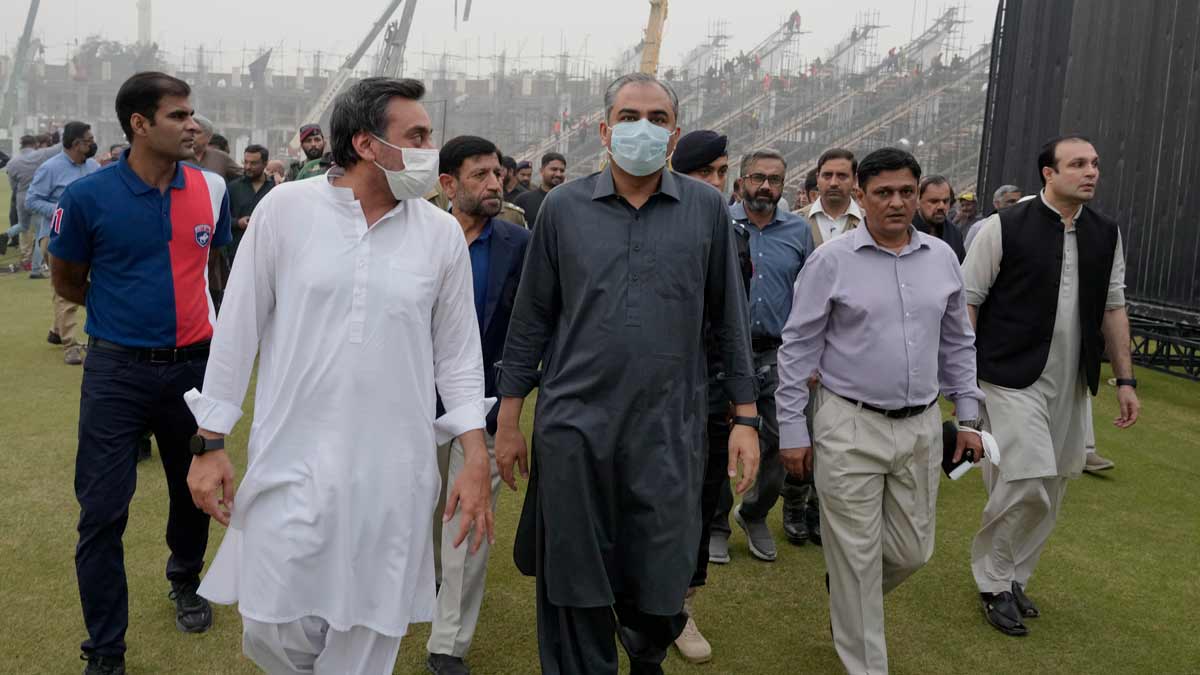 Pakistan's Interior Minister and Chairman of Pakistan Cricket Board Mohsin Naqvi, center, visits to review up-gradation work at the Gaddafi Stadium in preparation for upcoming ICC Champions Trophy 2025, in Lahore | AP