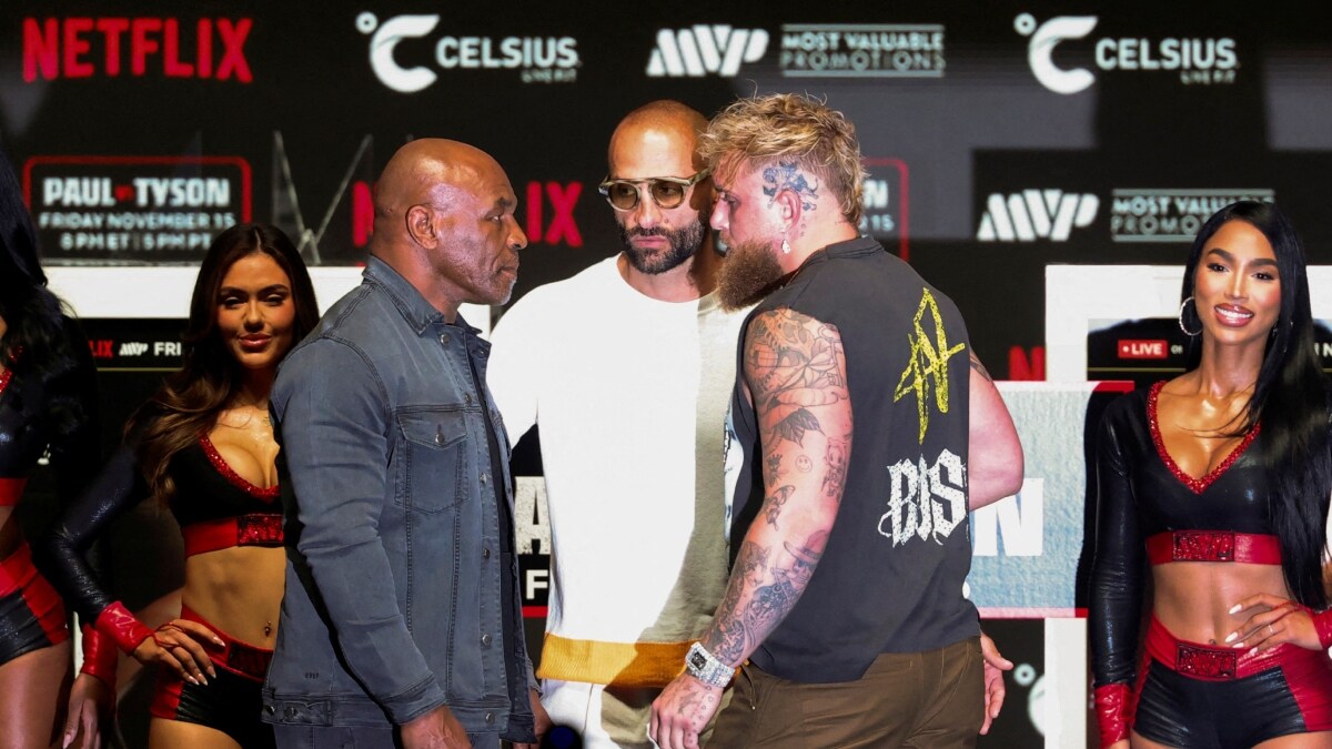 Jake Paul (R) faces off with Mike Tyson during a press conference | Reuters