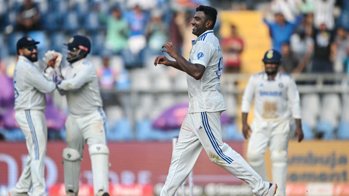 India's Ravichandran Ashwin celebrates after taking the wicket of New Zealand's Will Young