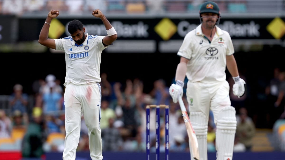 India's Jasprit Bumrah (L) celebrates dismissing Australia's Travis Head | AFP